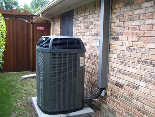 Trane Air Conditioning Unit Outside, insulated pipes