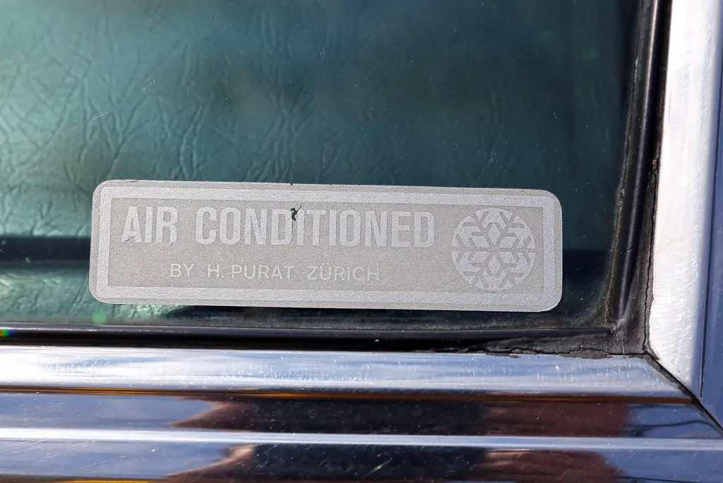 Vintage aftermarket air conditioning sticker on an old Alfa Romeo Montreal